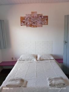 En eller flere senge i et værelse på Casa de Praia Figueiredo