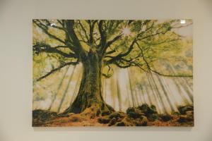 a painting of a tree in a forest at Luton Nook and Kitchen 4 mins to Luton AirPort in Luton