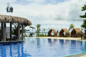 a swimming pool at the resort at Mactan Newtown Beach Condo in Lapu Lapu City
