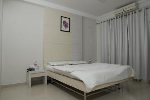Postel nebo postele na pokoji v ubytování Hotel Aashish Deluxe Pet Friendly