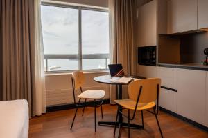 Телевизор и/или развлекательный центр в Hotel Bahía de Vigo
