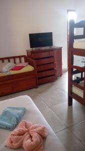 Postel nebo postele na pokoji v ubytování Hospedaria Cobras E Lagartos