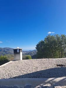 a building sitting on top of a pile of gravel at Paraje del Almendral- Casa Grande in Lanjarón