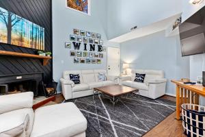 a living room with white furniture and a fireplace at Laurelwood 73 with Wintergreen Advantage in Wintergreen
