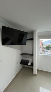 TV a/nebo společenská místnost v ubytování Hotel Medellín 66