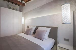 Posteľ alebo postele v izbe v ubytovaní Elegant and Bright Flat near the Duomo