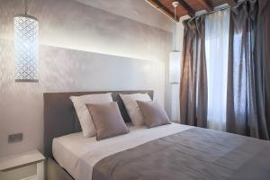 Posteľ alebo postele v izbe v ubytovaní Elegant and Bright Flat near the Duomo