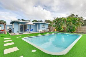 a swimming pool in the yard of a house at Private Pool and Patio Fort Lauderdale Home! in Fort Lauderdale