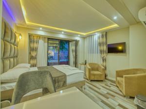 a hotel room with a bed and a bathroom at GALATAGREENAPPLEHOTEL in Istanbul