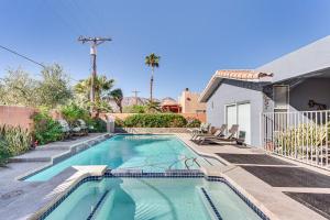 a swimming pool in the backyard of a house at Heated Pool at 3 BR Home 5 Mi to Coachella! in La Quinta