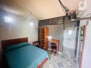 Postel nebo postele na pokoji v ubytování Hotel Lol Tun