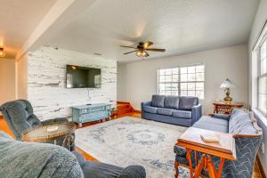 a living room with a couch and a tv at Walk to Beach and Relax by Pool St Augustine Home in Saint Augustine