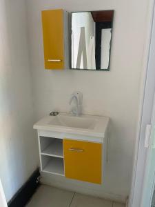 a bathroom with a sink and a mirror at Pousada Bela Casa Geribá in Búzios +22 photos