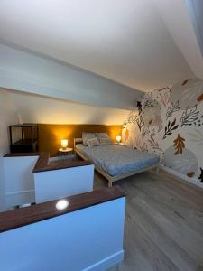 a living room with a bed and a couch at Le Terracotta - joli duplex centre ville in Cherbourg en Cotentin