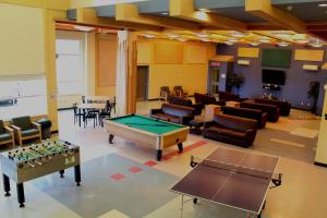 a room with a pool table and a classroom at Residence & Conference Centre - Sudbury West in Sudbury