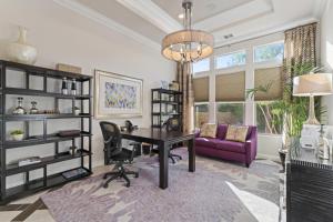a living room with a desk and a purple couch at Luxury Griffin Estate 4900sf Compound Pure luxury WALK TO COACHELLA AND STAGECOACH in La Quinta +59 photos