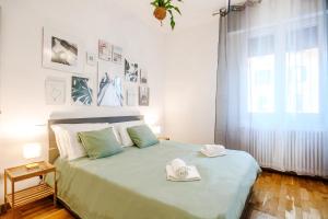 Ένα ή περισσότερα κρεβάτια σε δωμάτιο στο DiffeRent Home - Parcheggio privato