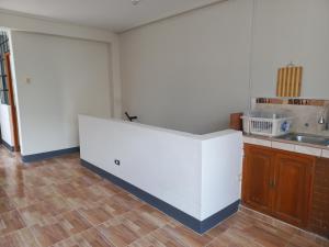 a kitchen with a counter and a sink at Céntrico Departamento en 2do Piso Caraz Dulzura in Caraz +12 photos