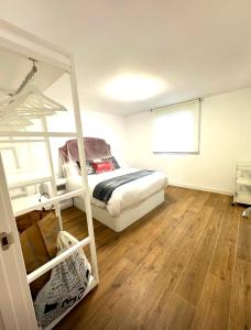 a bedroom with a bunk bed and a wooden floor at Casa rural in Cabra +23 photos