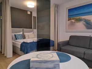 Posteľ alebo postele v izbe v ubytovaní MK Apartamenty Morski