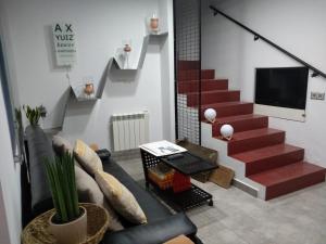 Televízia a/alebo spoločenská miestnosť v ubytovaní Landscape Benveniste