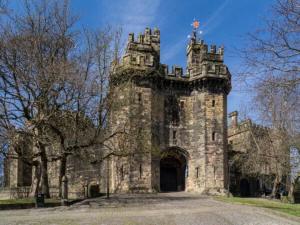 an old stone building with a gate in the middle at Williamson House Lancaster in Lancaster +10 photos