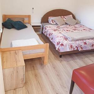 Rúm í herbergi á Prenoćište, sobe AN-KA