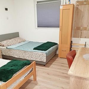 Rúm í herbergi á Prenoćište, sobe AN-KA