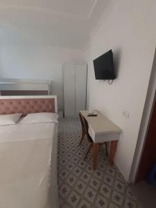 TV a/nebo společenská místnost v ubytování Villa-Hotel Ludianna