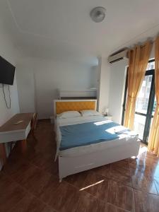 Postel nebo postele na pokoji v ubytování Villa-Hotel Ludianna