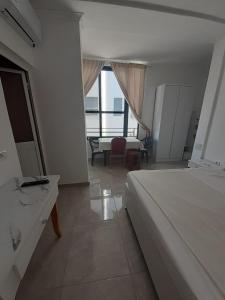Postel nebo postele na pokoji v ubytování Villa-Hotel Ludianna