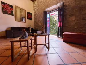 a living room with two tables and a couch at Casa monarca in Morelia