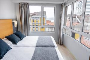 Postel nebo postele na pokoji v ubytování Hotel Faranda Pathos Gijón, Ascend Hotel Collection