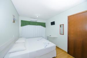 Postel nebo postele na pokoji v ubytování Pousada Iguassu Charm Suites