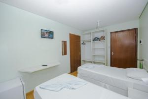 Postel nebo postele na pokoji v ubytování Pousada Iguassu Charm Suites