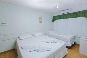 Postel nebo postele na pokoji v ubytování Pousada Iguassu Charm Suites