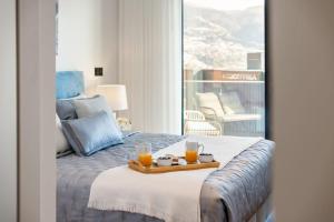 Postel nebo postele na pokoji v ubytování City View Condo + 44 fotografií