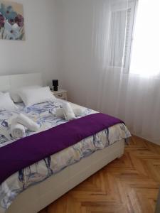 Ein Bett oder Betten in einem Zimmer der Unterkunft House Branka