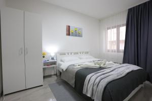 Ένα ή περισσότερα κρεβάτια σε δωμάτιο στο Ivan's guesthouse
