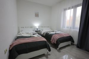 Ένα ή περισσότερα κρεβάτια σε δωμάτιο στο Ivan's guesthouse