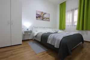 Ένα ή περισσότερα κρεβάτια σε δωμάτιο στο Ivan's guesthouse