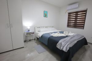 Ένα ή περισσότερα κρεβάτια σε δωμάτιο στο Ivan's guesthouse
