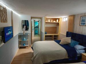 Postel nebo postele na pokoji v ubytování Hotel Ciudad Ambato