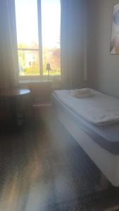 Postel nebo postele na pokoji v ubytování mellanbrons B&B