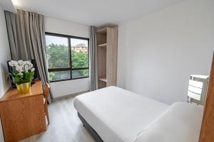 Postel nebo postele na pokoji v ubytování Hotel Faranda Los Tilos, Ascend Hotel Collection
