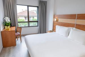 Postel nebo postele na pokoji v ubytování Hotel Faranda Los Tilos, Ascend Hotel Collection