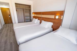 Postel nebo postele na pokoji v ubytování Hotel Faranda Los Tilos, Ascend Hotel Collection