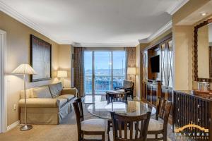 a living room with a couch and a table at MGM Signature-09-820 1Br 2Ba F1 Pits View Balcony in Las Vegas