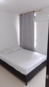 Katil atau katil-katil dalam bilik di Apartamento Valparaiso +7 gambar
