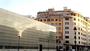 a building with a reflection of a building at Hostal Lar in Burgos